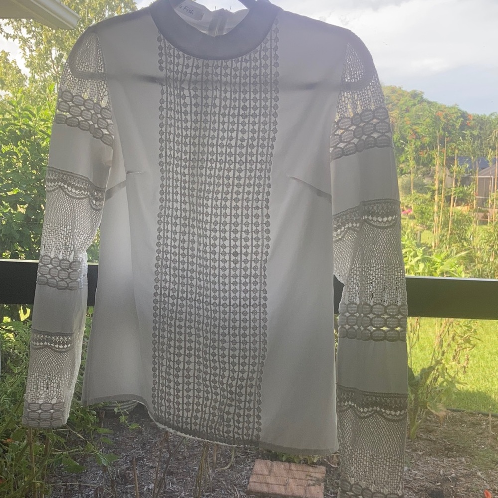 Never worn. Pretty white long sleeve blouse